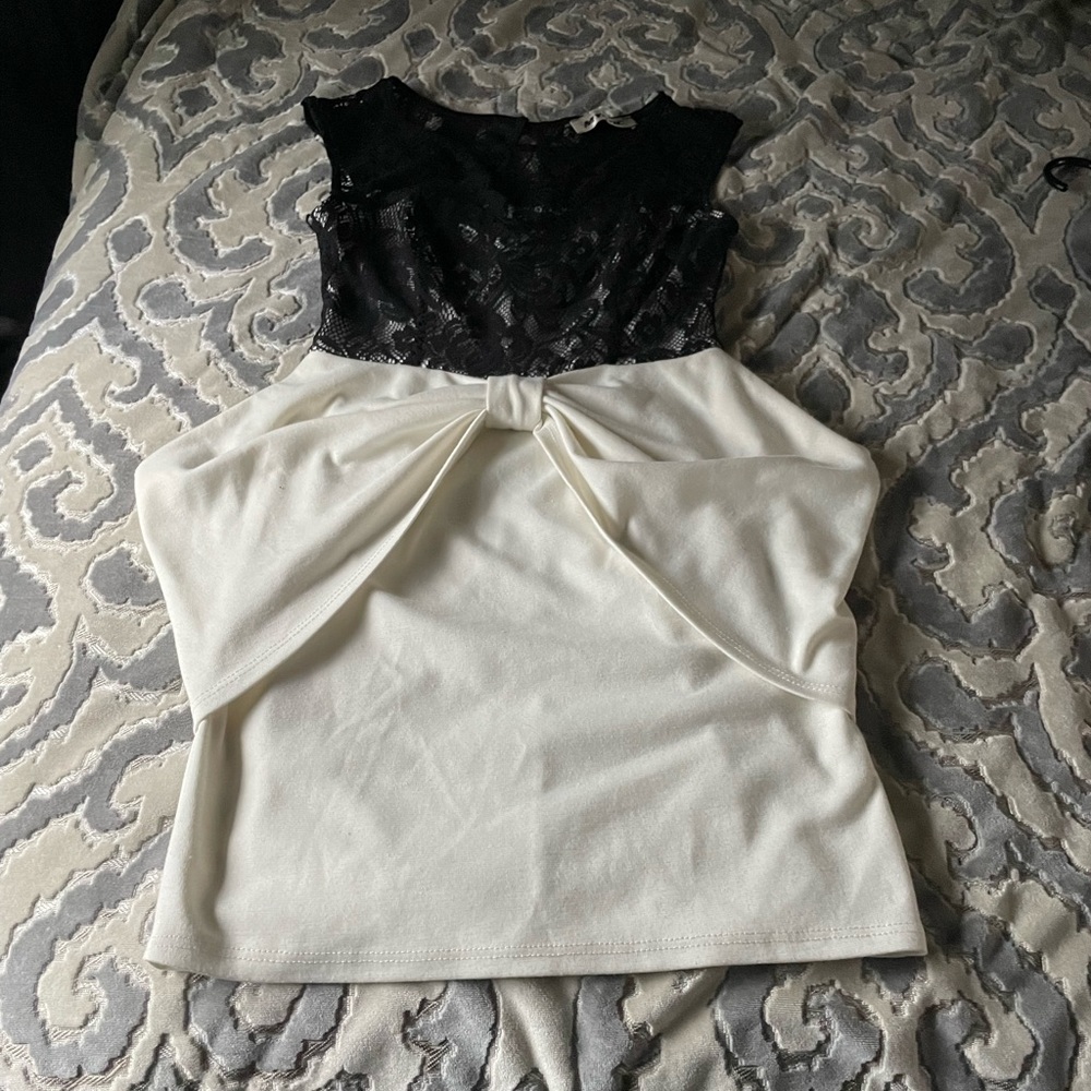 Cute black and off white dress with bow across bottom front